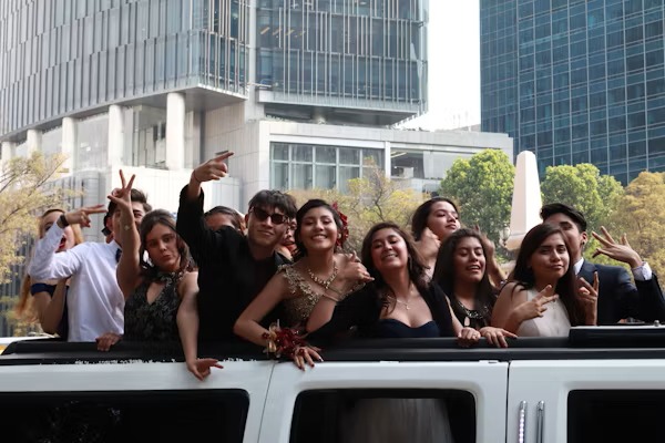 Happy customers enjoying luxury limousine service from www.logisticsflowhub.xyz during a memorable event.